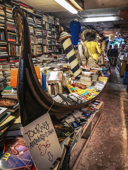 Libreria Acqua Alta Bookshop in Venice is the only bookshop in the world to have a gondola of floating books during acqua alta each winter.