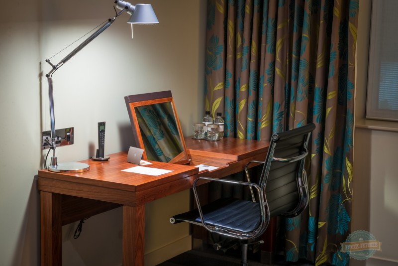 Desk area in the room at the apex london wall hotel