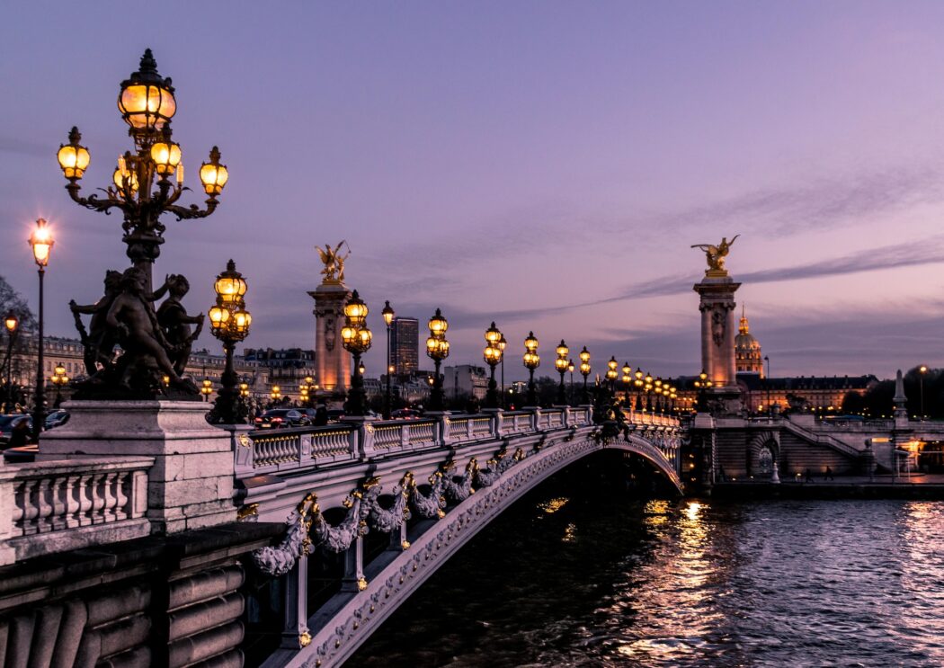 A bridge over the River Seine in Paris at night.