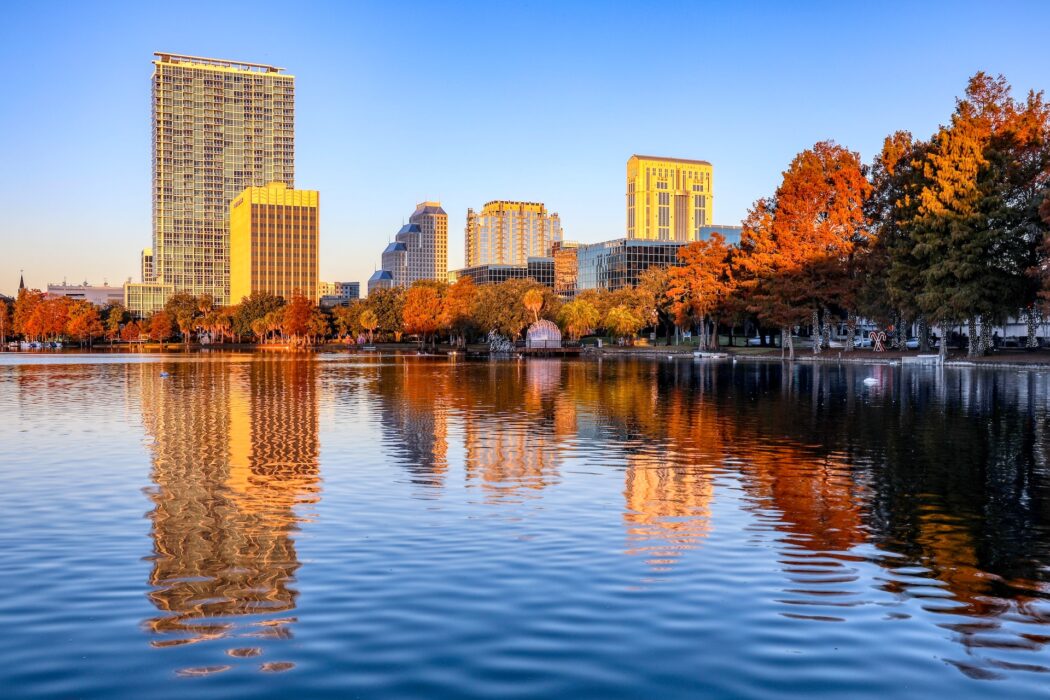 The skyline of Orlando, Florida with its skyscrapers and lake in the Autumn.