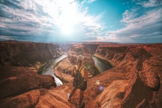 A female looking out over Horseshoe bend canyon in the US