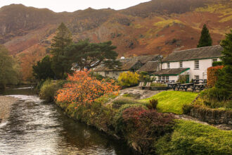 A cottage along the waters edge in the Lake District, Cumbria, England