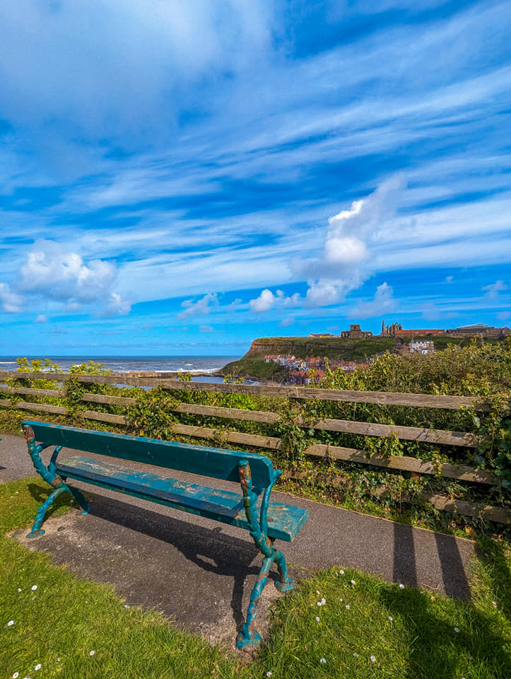 Bram Stoker's Bench on the hill overlooking the water to the Whitby Abbey