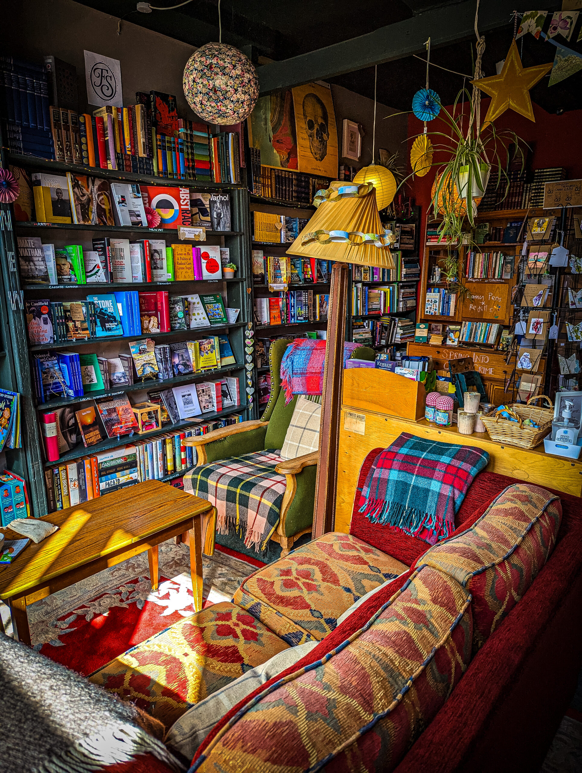 Inside McNab's bookshop with shelves of books and comfortable sofas to relax on.