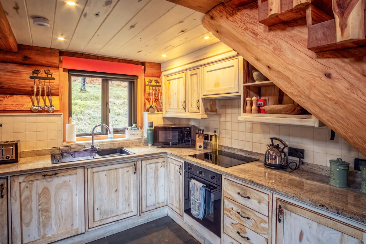 Fully equipped kitchen inside Eagle Brae log cabin in the Scottish Highlands self-catering accommodation near Inverness