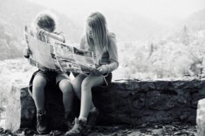 A boy and a girl reading a map