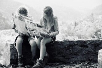 A boy and a girl reading a map